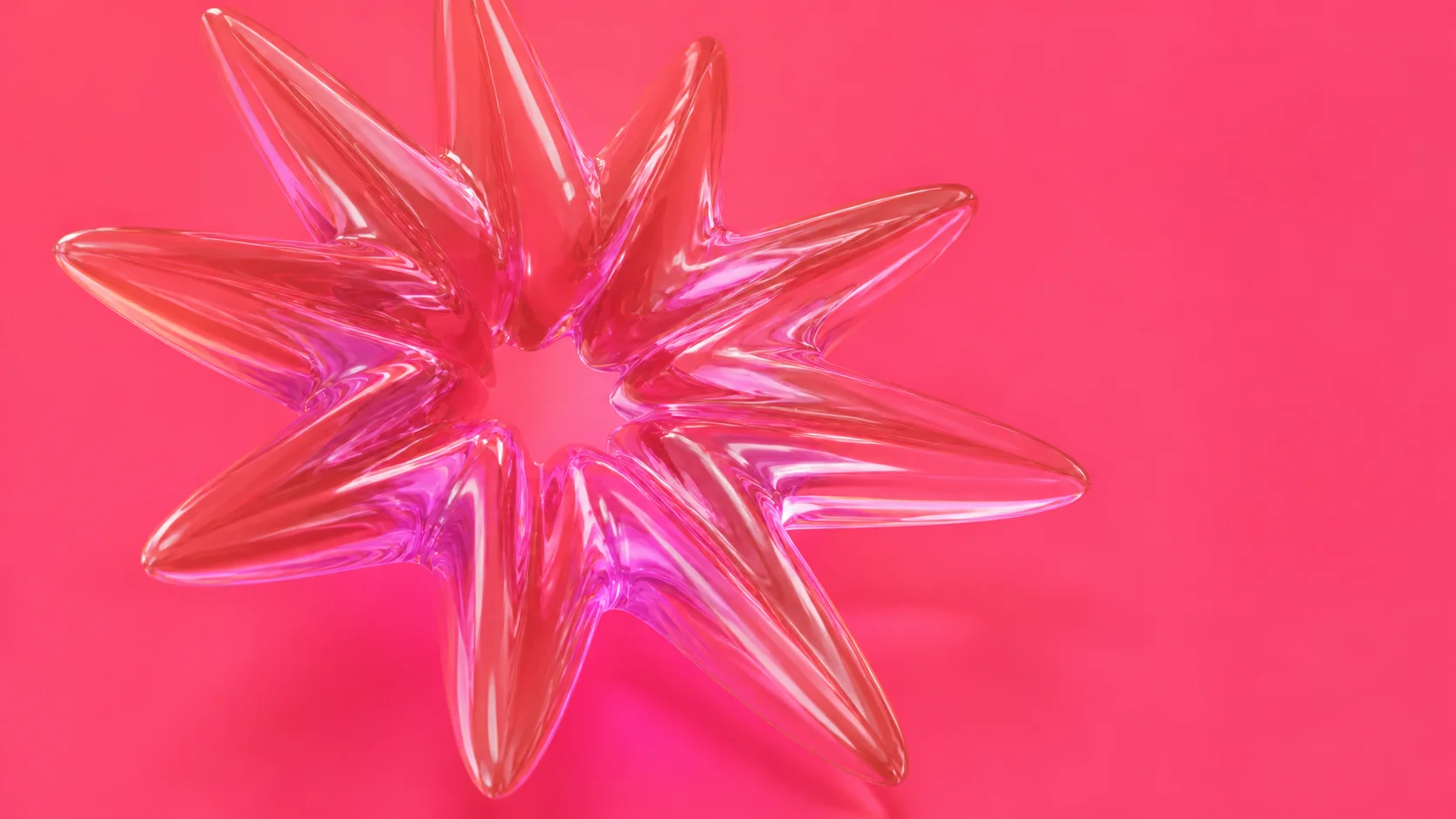 A translucent coral glass burst on a bright pink background, representing a social comment starting a conversation