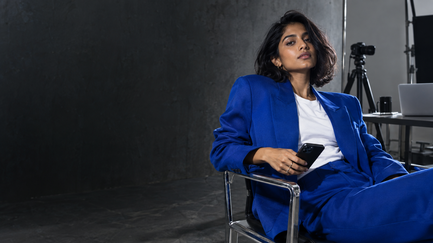The Studio: a creator in a cobalt blazer in her creative studio